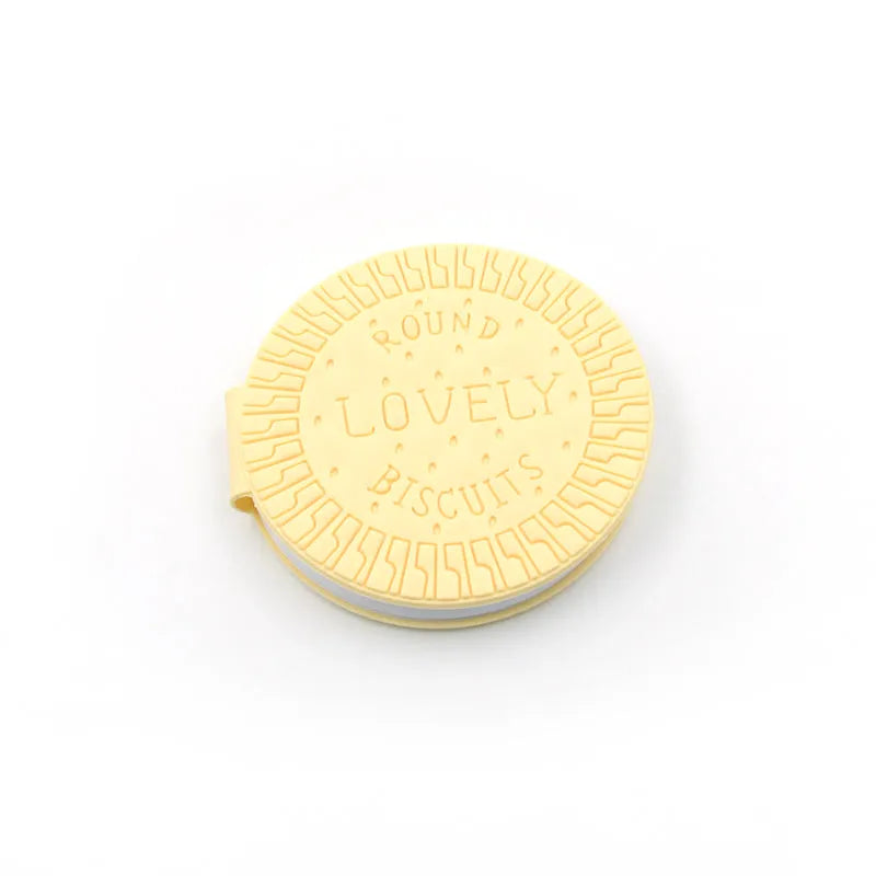 Round biscuit-themed notebook with embossed "Lovely Biscuits" text on cream cover