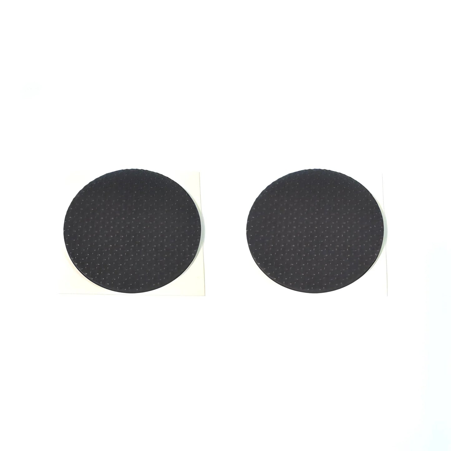 Round black felt pads with paper backing, two pads