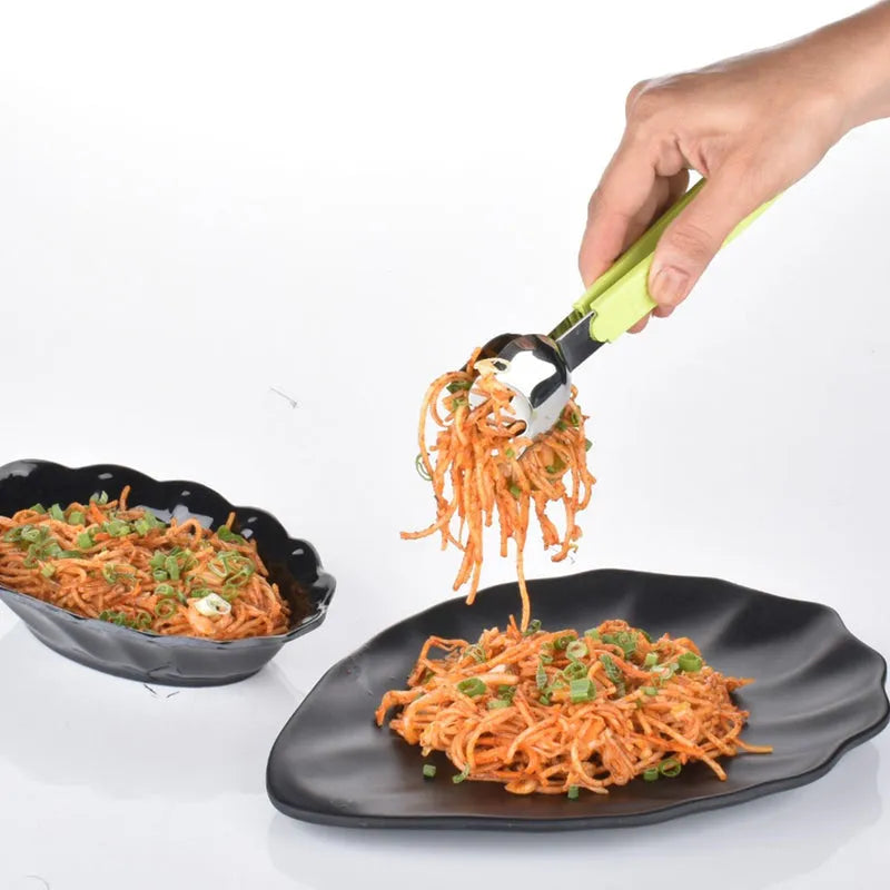 Salad serving tong with green handle and metal scoop, held above spaghetti salad