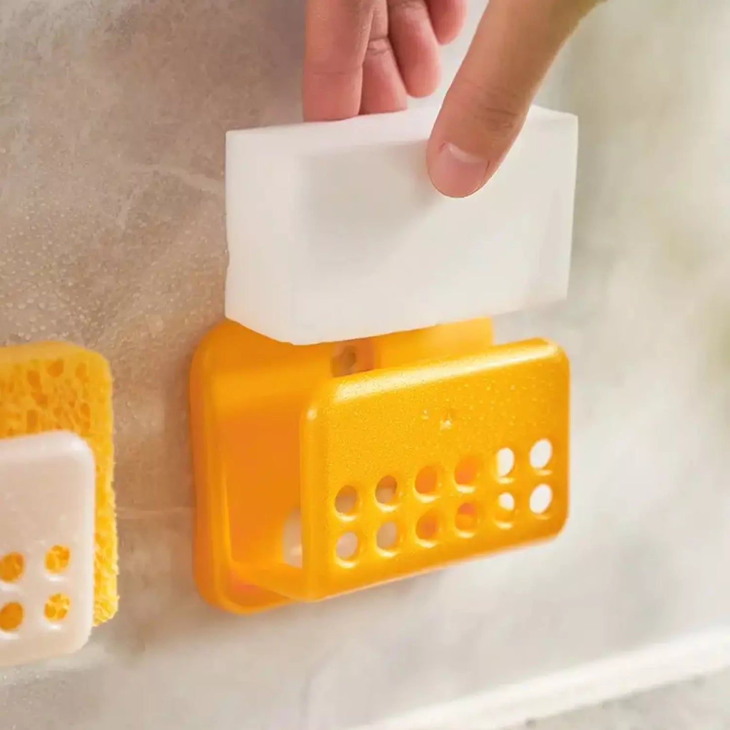 Orange self-adhesive sponge holder with perforated tray and open hook
