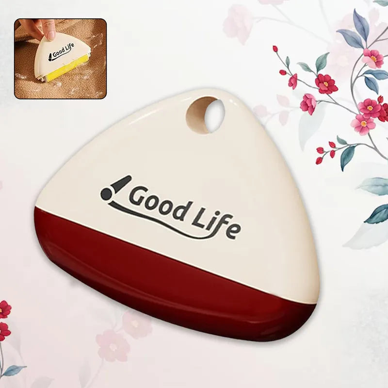 Reusable lint roller with cream handle and red base, oval head with central suction opening