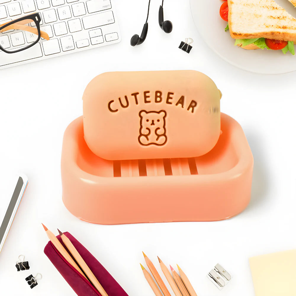 Orange soap eraser with plastic case, CuteBear bear logo on top