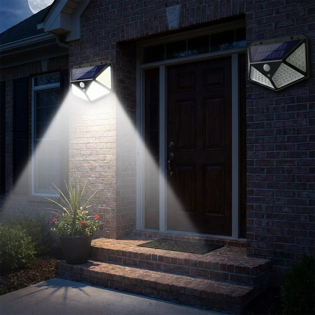 Solar wall lights illuminating steps near front door with motion sensor