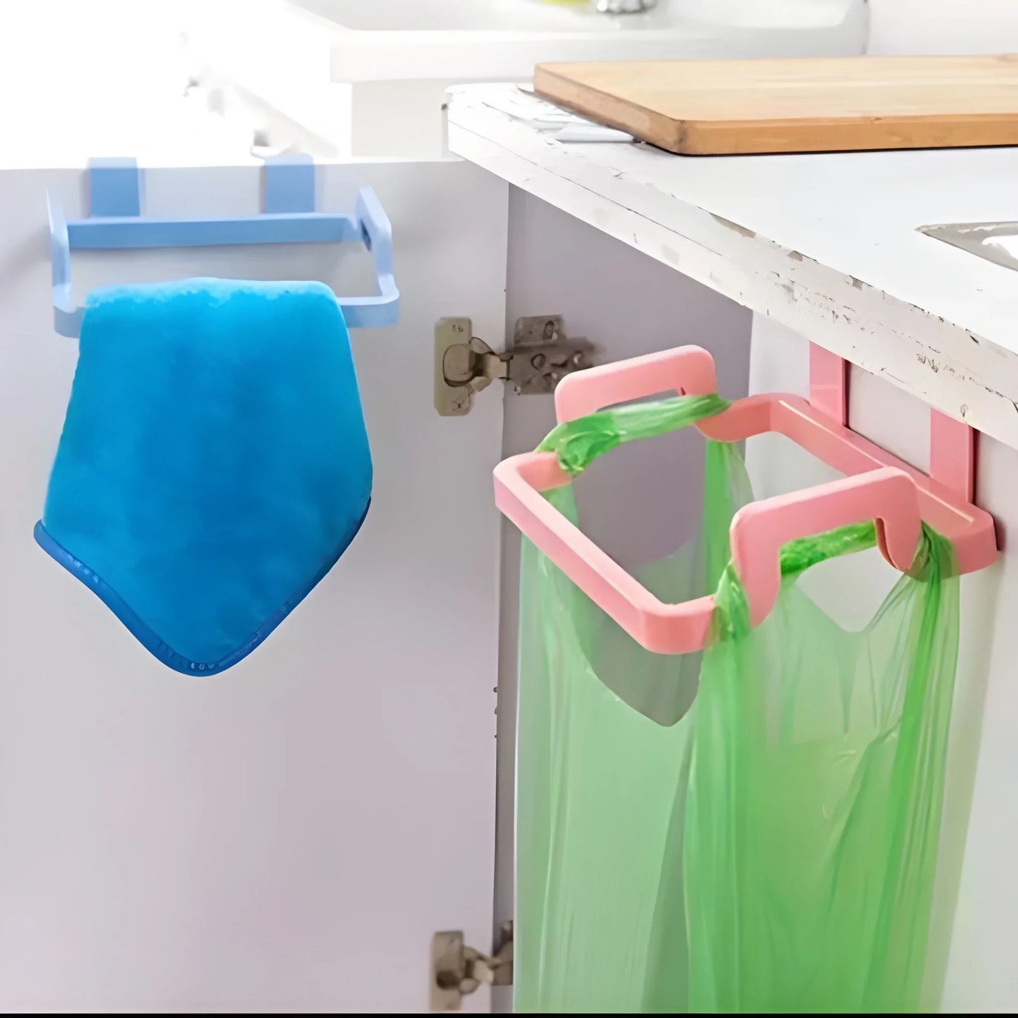 Space-saving bag holder with pink base holding green bags and one blue bag