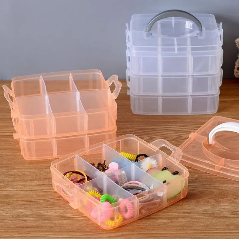 Stackable plastic craft storage boxes with divided compartments, translucent orange and clear