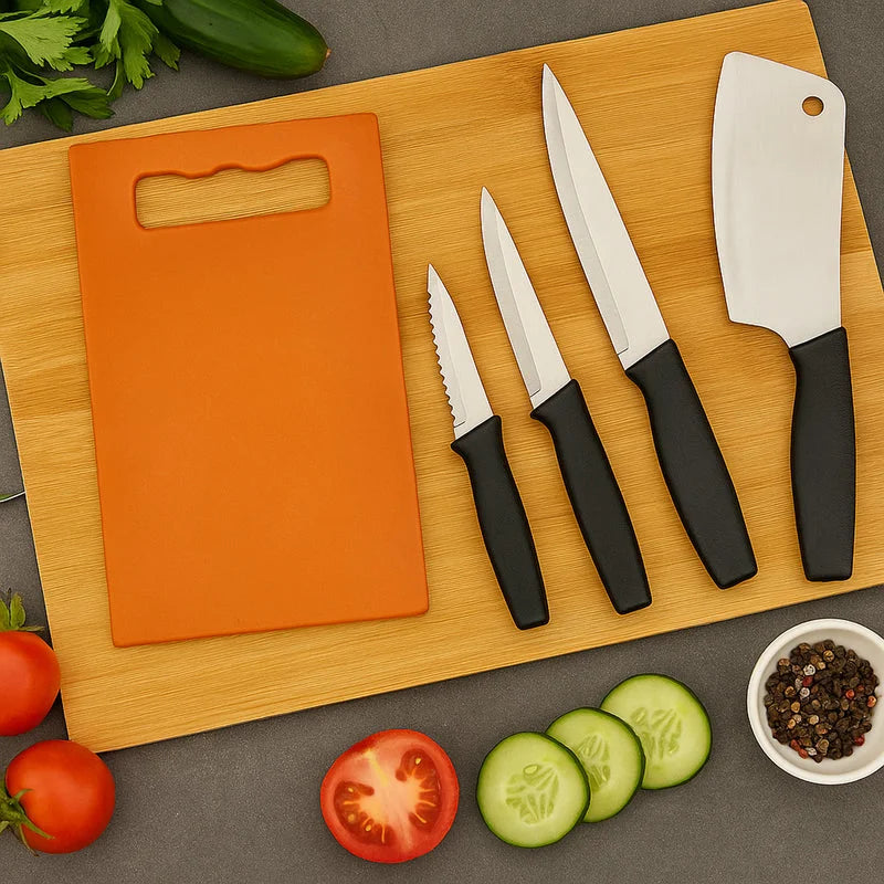 Stainless steel knife set with black handles and four blades on a wooden board