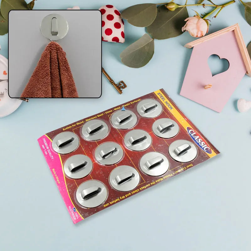 Set of 12 steel wall hooks with round silver hook heads on card