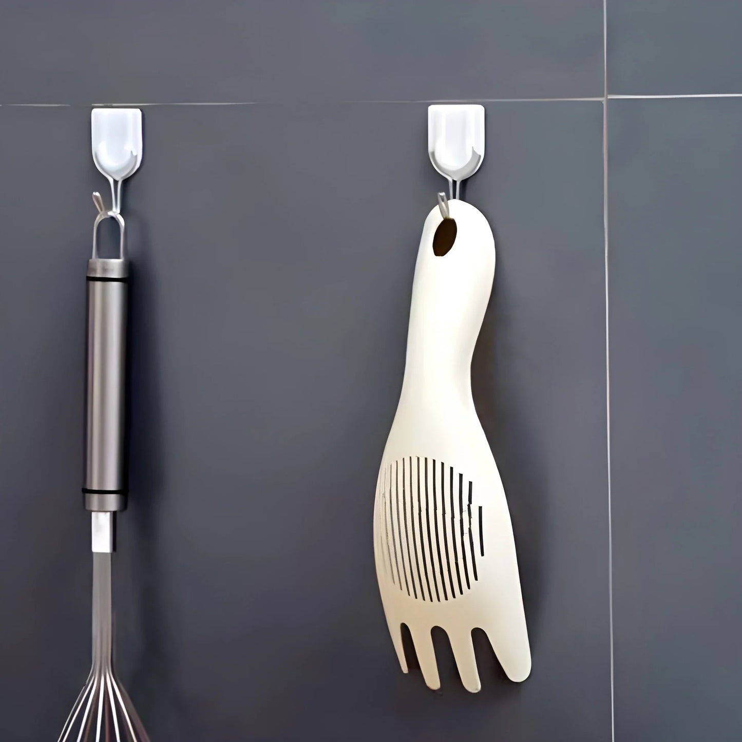 Rice strainer spoon with perforated forked head and looped hanging handle