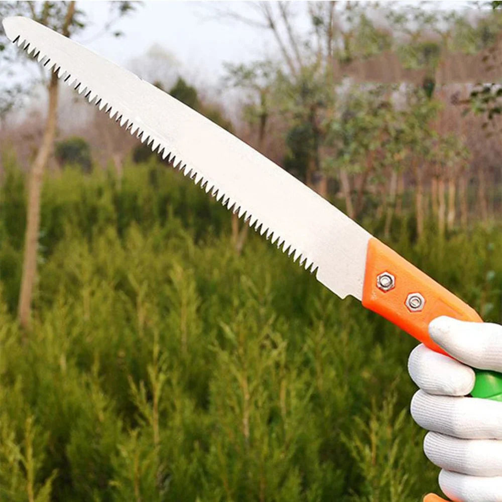 Tree pruning saw with orange handle and serrated blade, held in white gloves