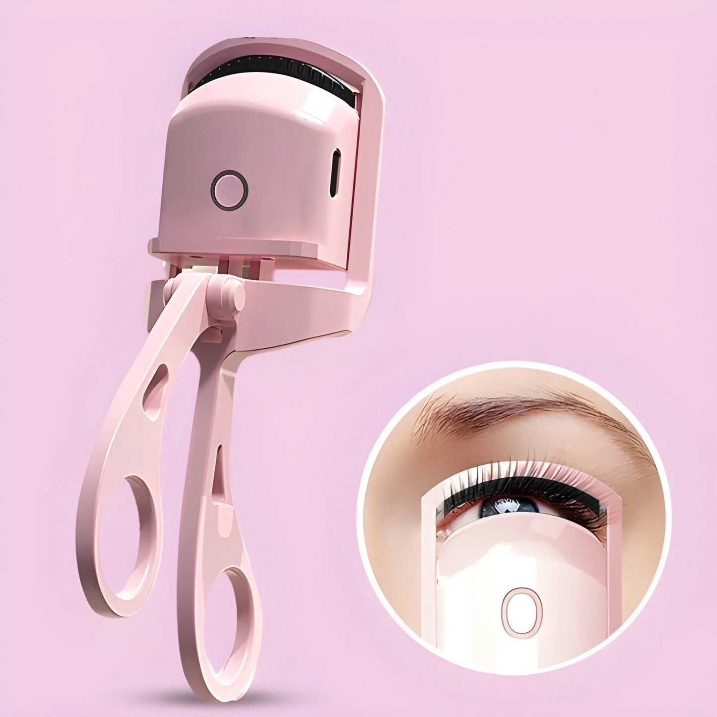 Heated eyelash curler in rose pink with hinged clamp and circular heat button