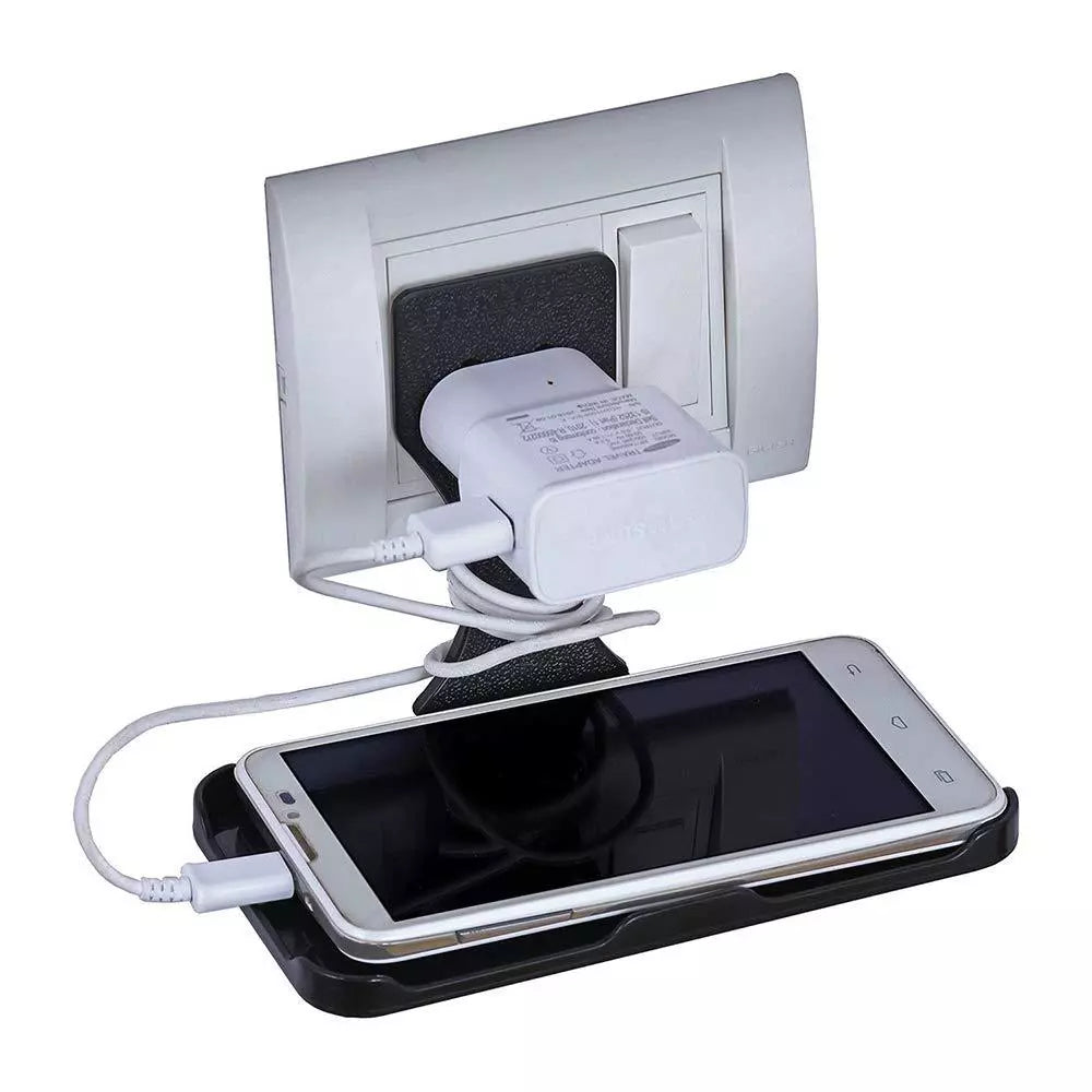 Wall-mounted phone charger stand with dark phone in cradle and white charging adapter