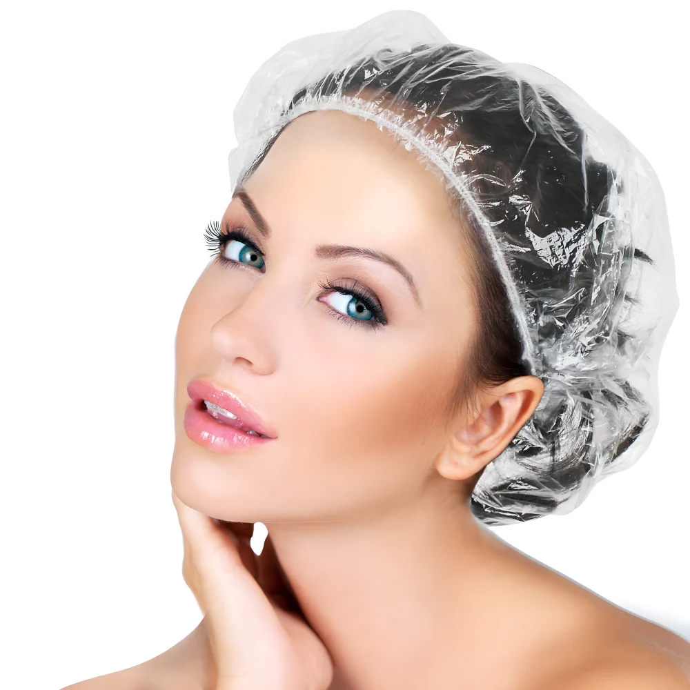 Clear waterproof disposable shower cap over hair