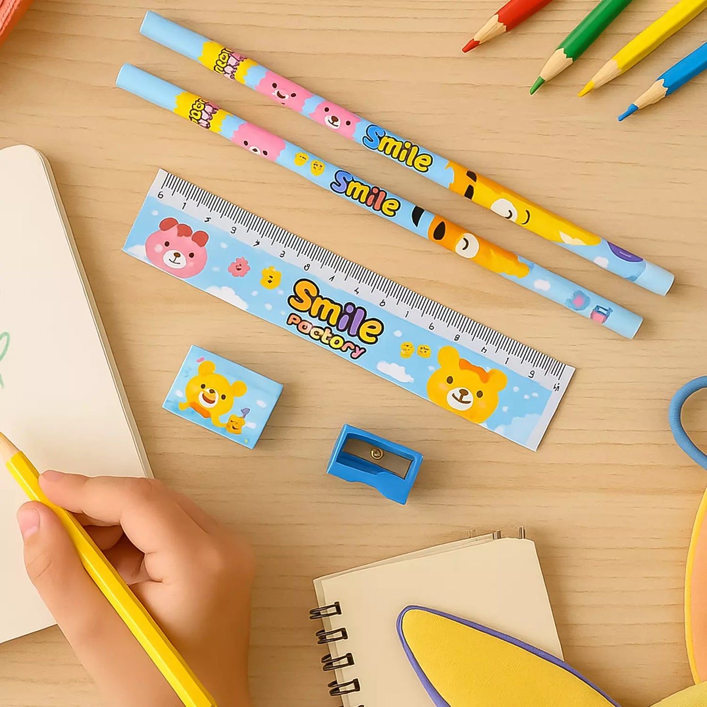 Wooden pencil gift set with colorful cartoon smiley pencils, yellow and light blue shafts.