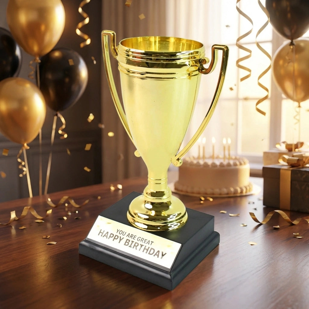 Golden trophy cup with handles; base reads “HAPPY BIRTHDAY”