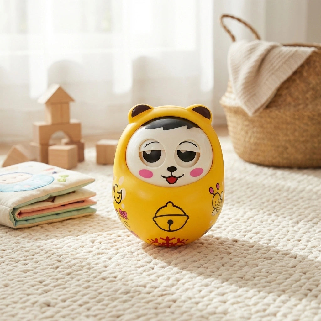 Musical roly poly toy with yellow cat face, bell and bell-shaped base