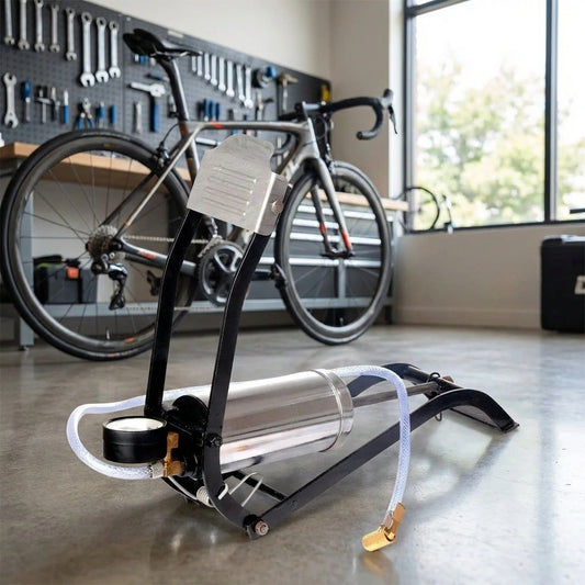 Bicycle floor air pump with foot pedal, hose, and black gauge
