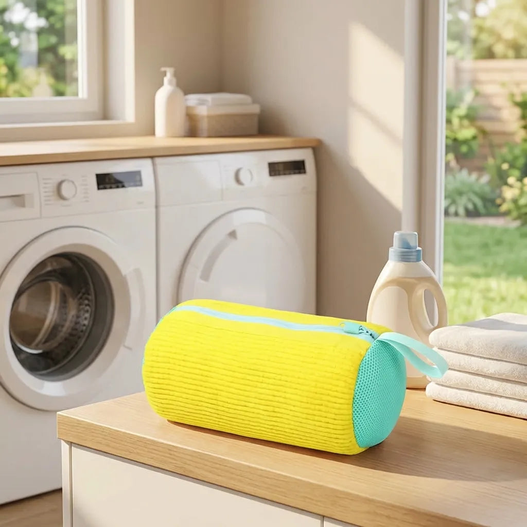 Reusable shoe wash bag, yellow fabric cylinder with teal mesh panel and handle strap