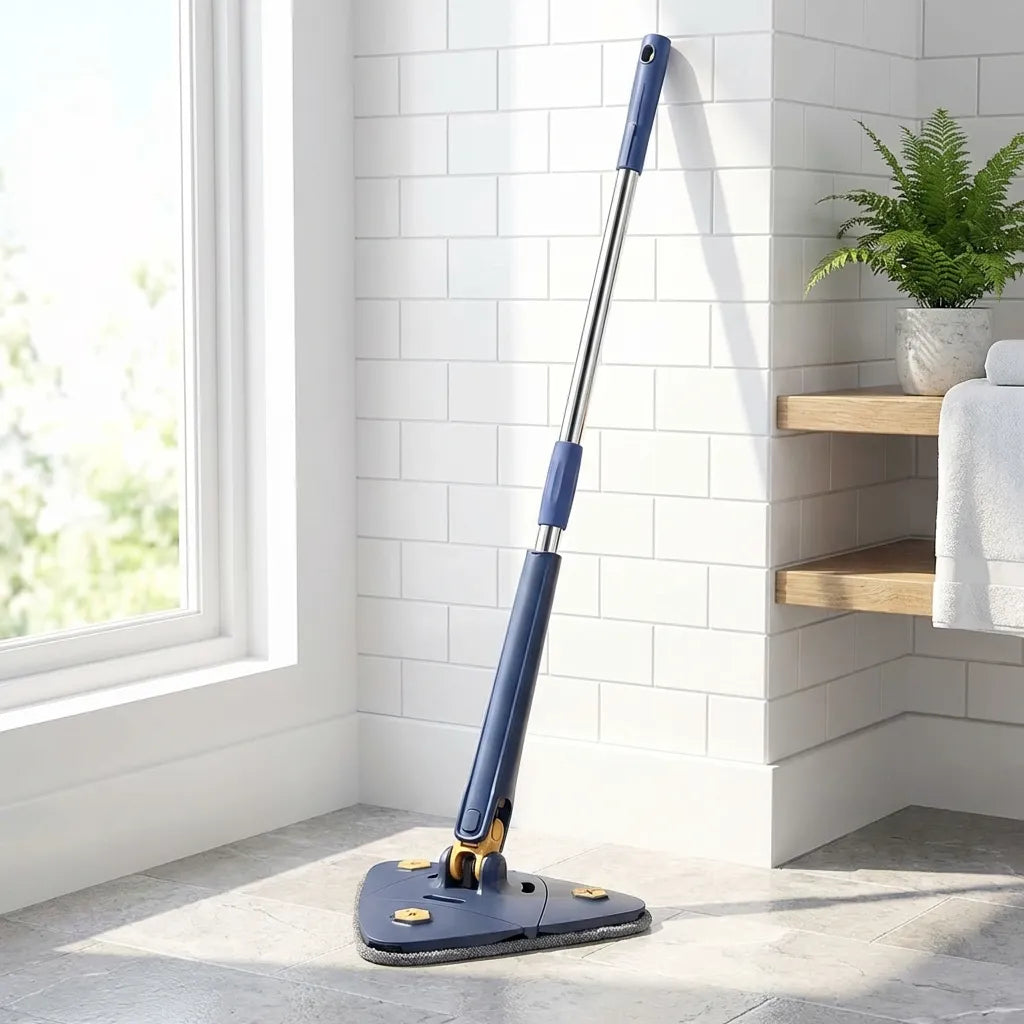 Blue extendable triangle mop with triangular grey pad in a corner on tile