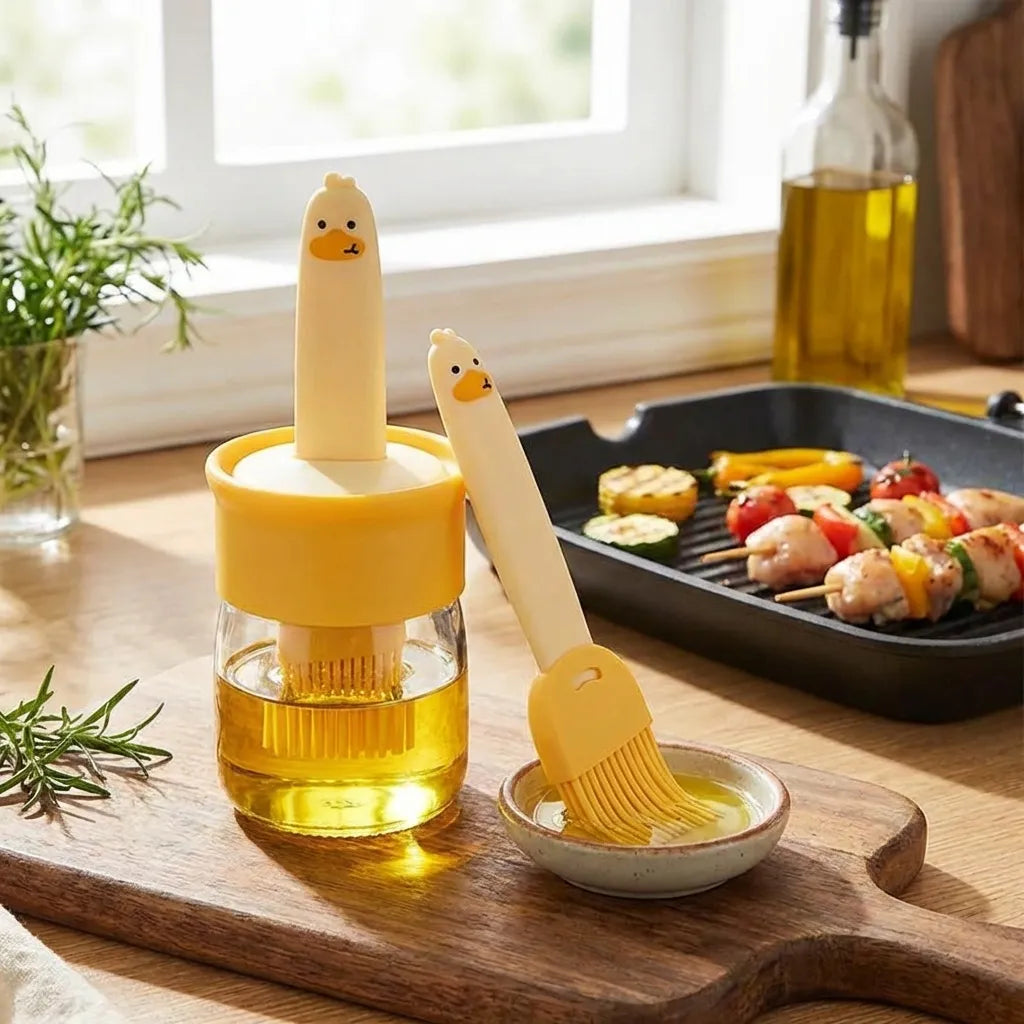 2-in-1 oil dispenser close-up with yellow container and character spout brush