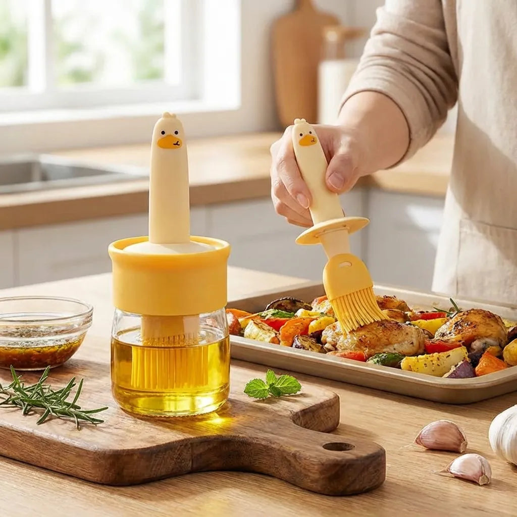 2-in-1 oil dispenser dispensing oil onto roasted food with brush applicator