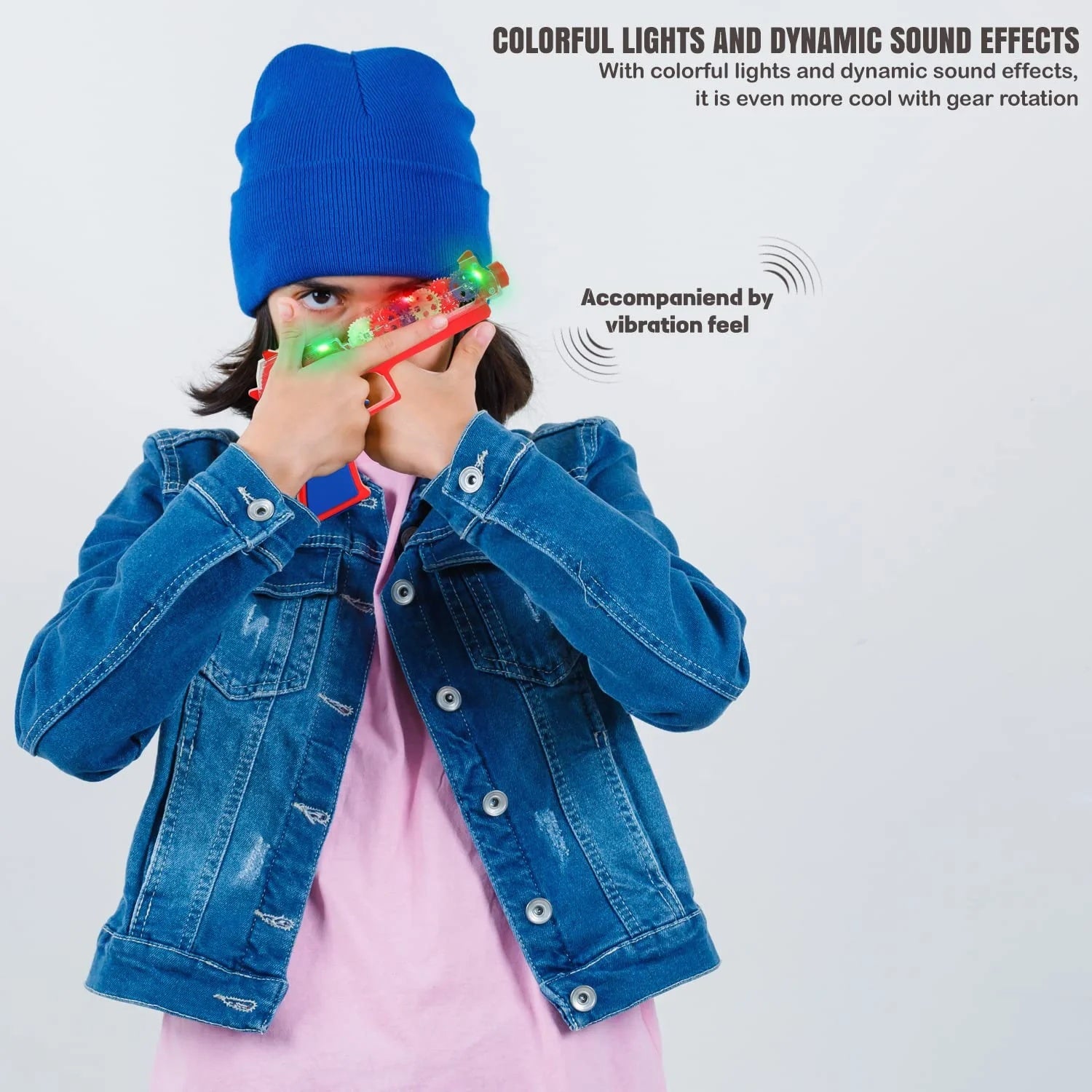 Red and blue toy gun flashing with colorful lights held by child