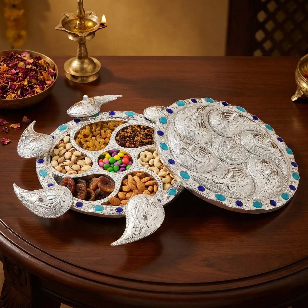 Silver 7-compartment dry fruit serving tray with carved edges and blue stud details