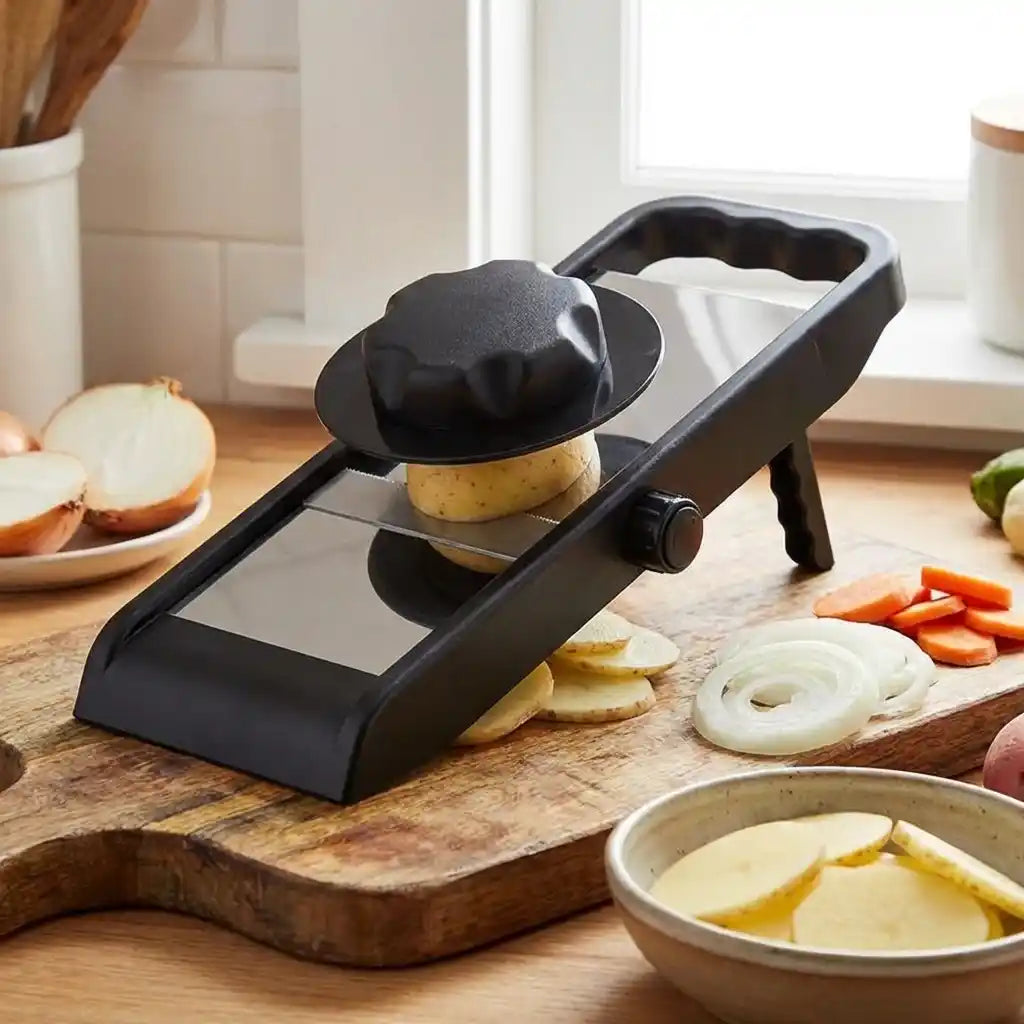 Adjustable slicer and grater, black design, grating potato and onion slices