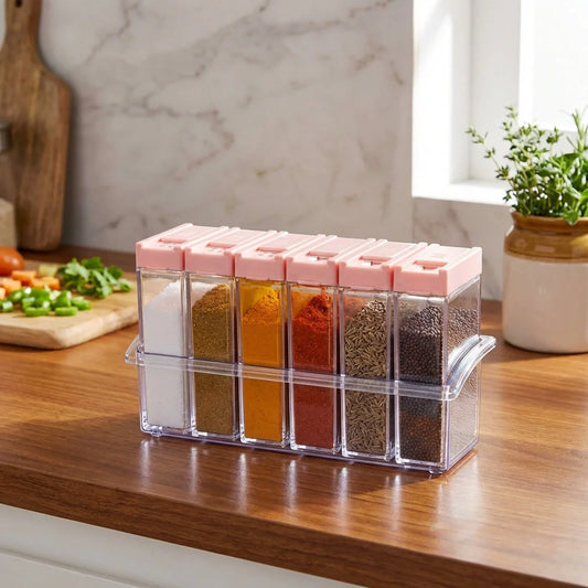 Airtight spice jars set with clear containers and pink lids, filled with spices