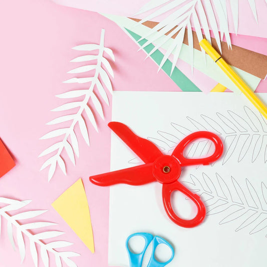 Red kids safety scissors with rounded blades and loop handles