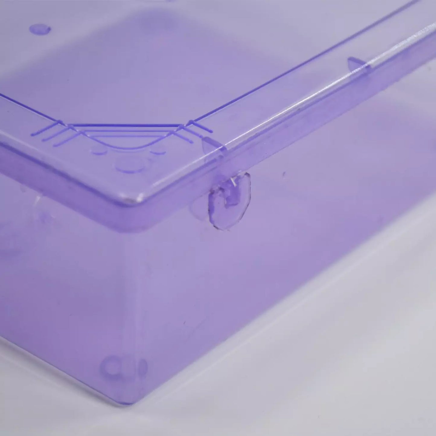 Purple plastic storage bin with clear edge corner