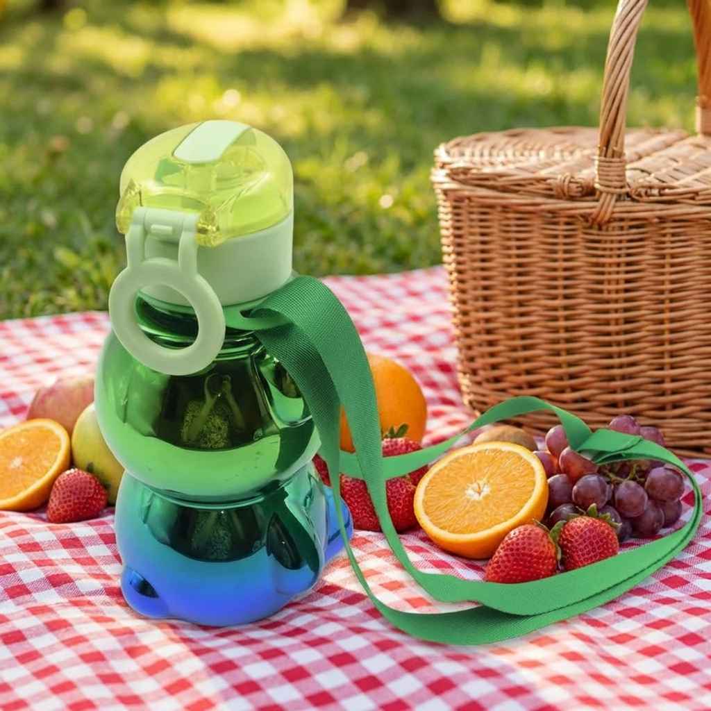 Kids green straw water bottle with handle strap and flip straw lid, blue feet detail