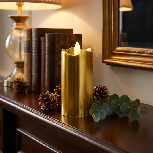Gold flameless LED decorative candle with glowing wick, cylindrical pillar style