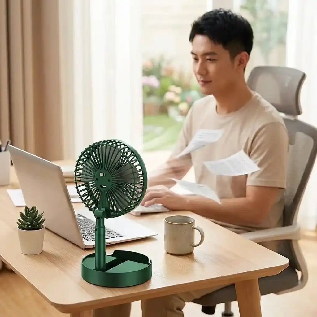 Green foldable telescopic fan with circular grille on round base stand