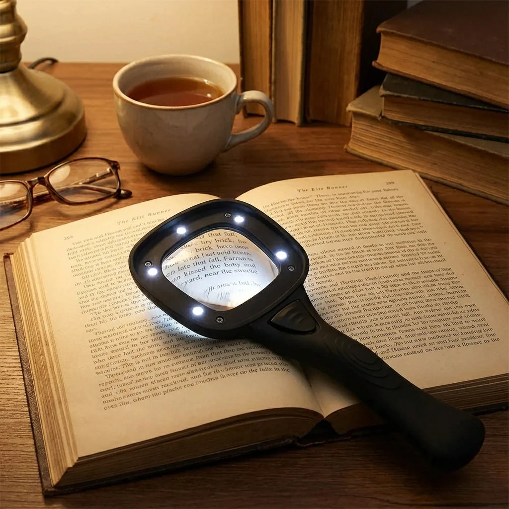 Handheld LED magnifying glass with white LED glow over printed text