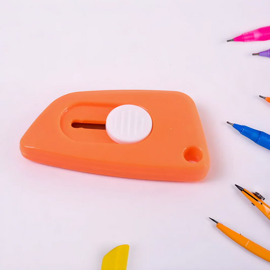 Orange mini cloud box cutter with finger hole and blade slot