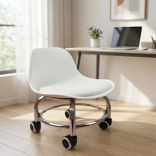 Low rolling stool with light gray cushioned seat and chrome base, four caster wheels