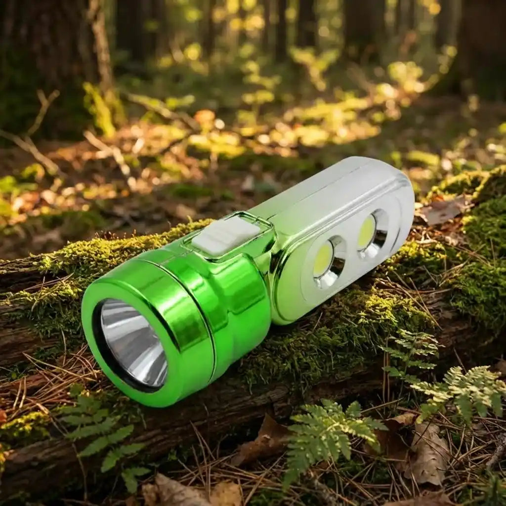Green multi-LED torchlight with silver lens cover and two LED bulbs visible