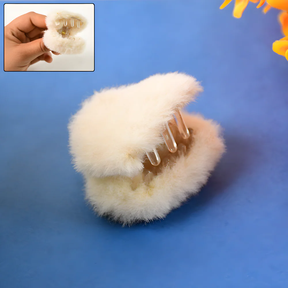 Cream plush claw hair clip with clear-toned teeth