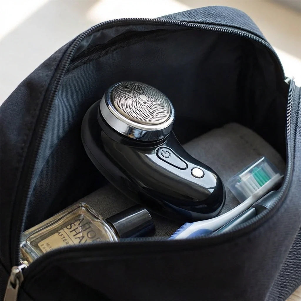 Black electric shaver in a zippered travel pouch, round head visible