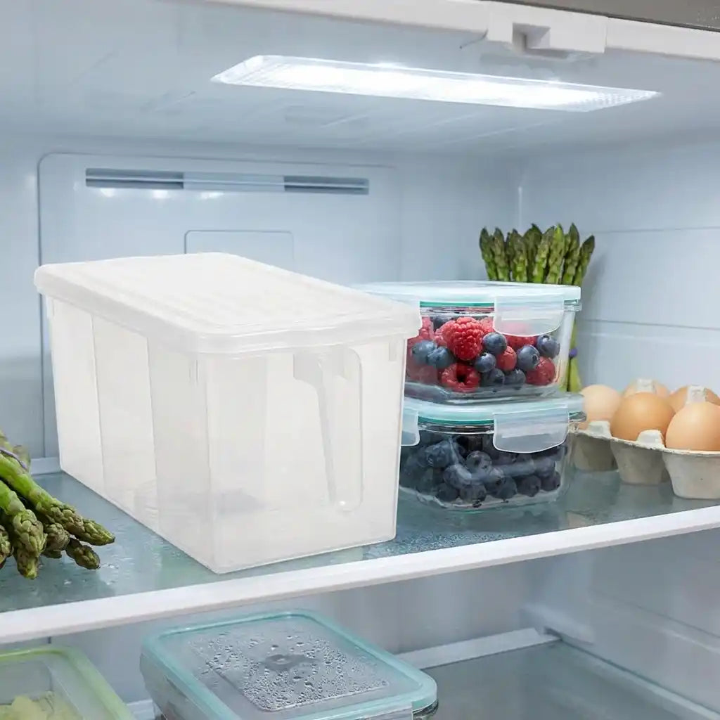 Clear plastic refrigerator organizer box with white lid, used for storing produce.