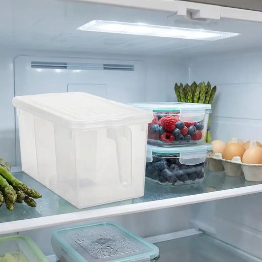 Clear plastic refrigerator organizer box with white lid, used for storing produce.