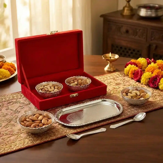 Silver plated serving bowl set with tray and spoons in open red presentation box