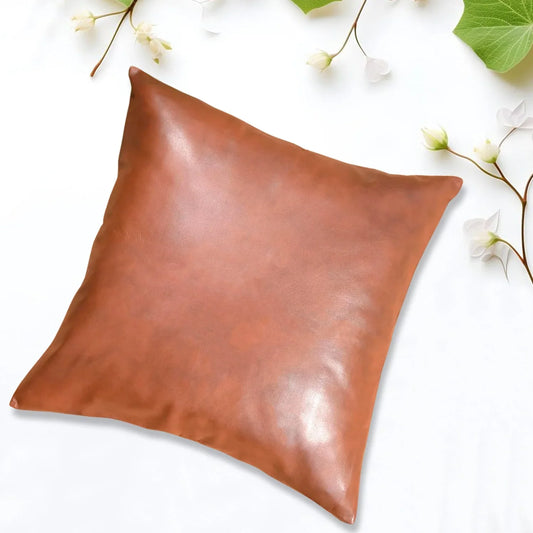 Square decorative pillow cover, smooth brown fabric with subtle sheen and folded corner seam