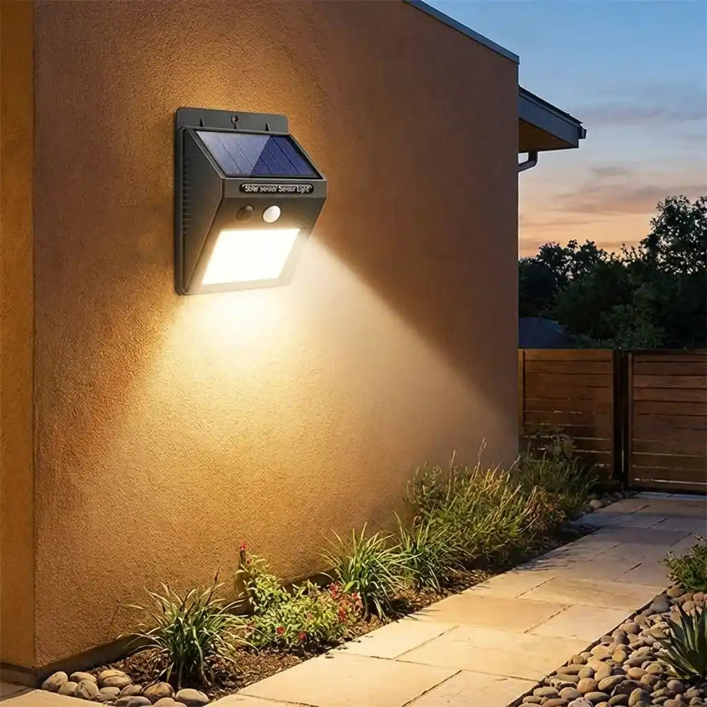 Solar motion LED wall light with upturned solar panel and bright front LED