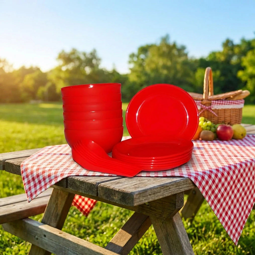 Red soup bowl set with stacked bowls and a serving plate, folded cloth underneath