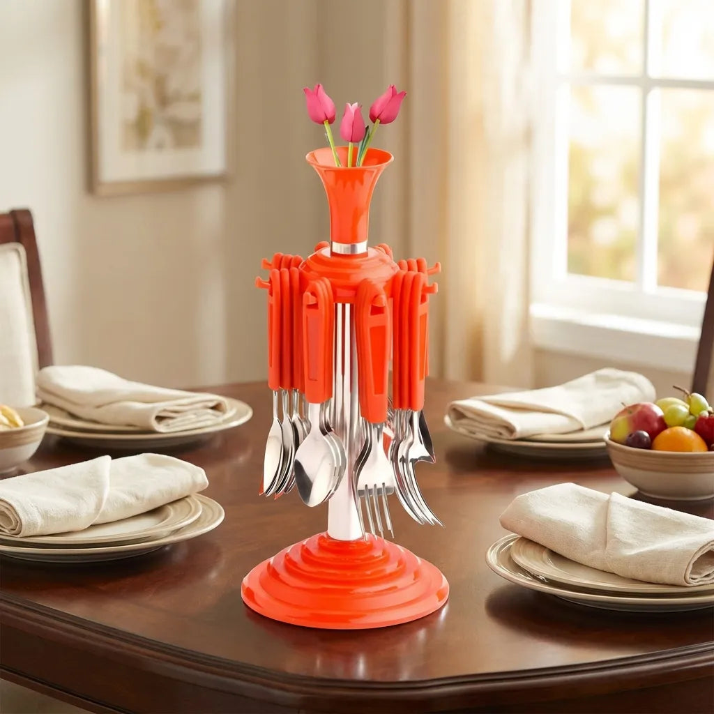 Stainless cutlery set with an orange base, metal forks and spoons, standing as a centerpiece bundle.