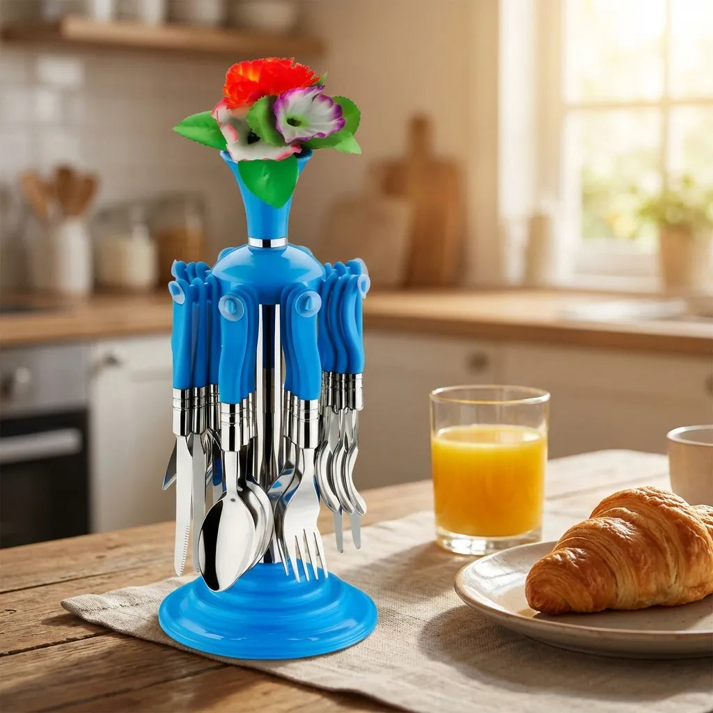 Stainless cutlery set with a blue base and metal forks and spoons, topped with a flower vase.