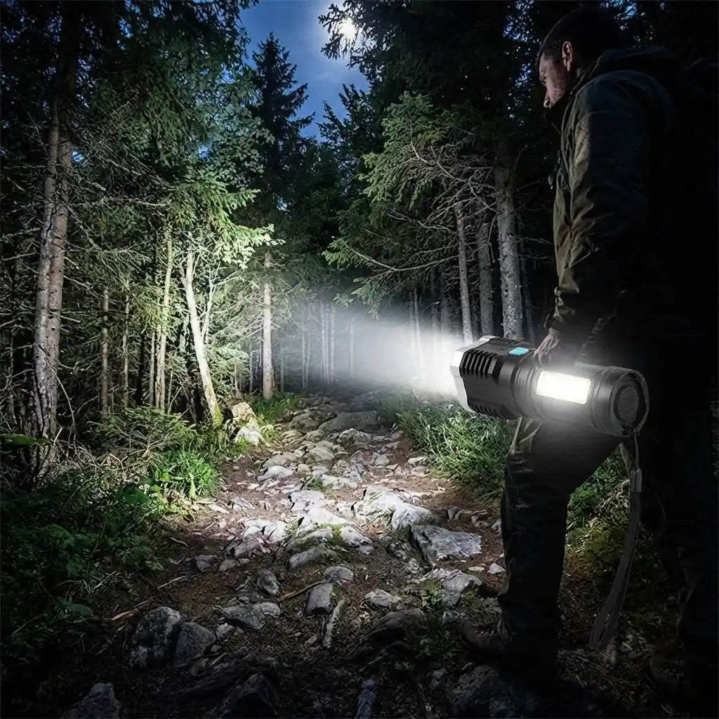 Black LED torch light aimed forward, front glow creating a long white beam
